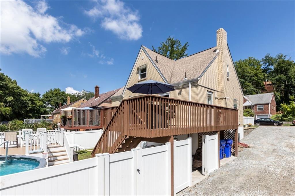 5116 Glenhurst Road Pittsburgh, PA 15207 - Photo 21 of 23 a view of a house with wooden fence
