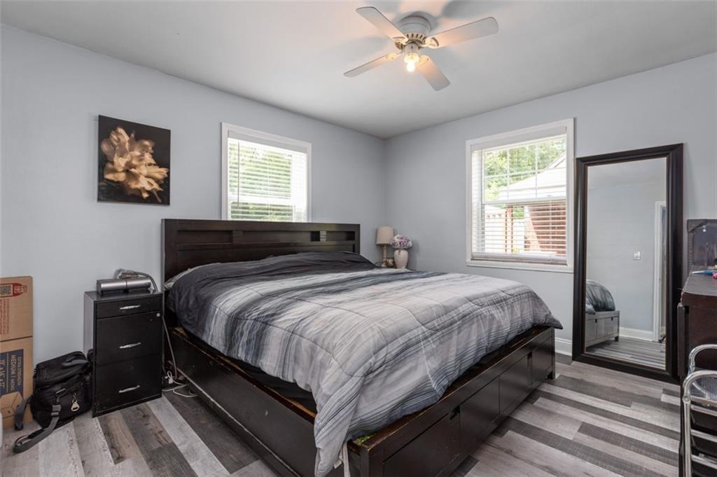 5116 Glenhurst Road Pittsburgh, PA 15207 - Photo 10 of 23 a bedroom with a bed and a chandelier