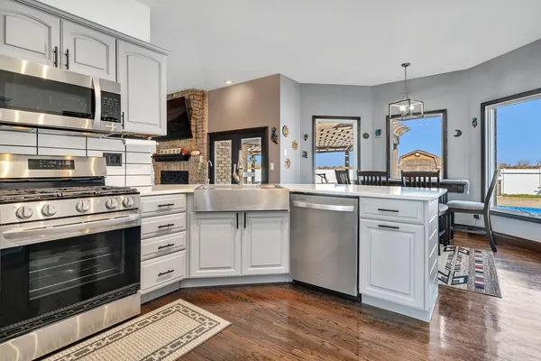 a kitchen with cabinets and stainless steel appliances