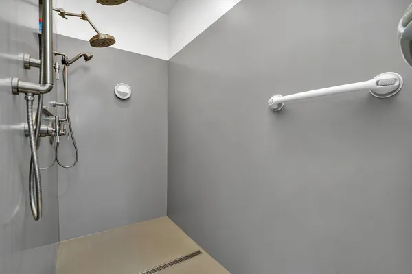 a bedroom with a bed window and a chair