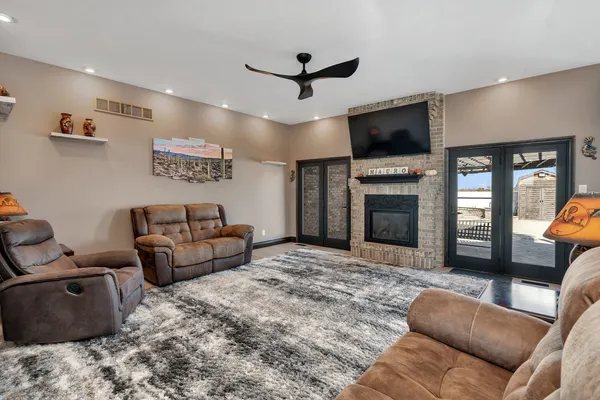 a living room with furniture and kitchen view