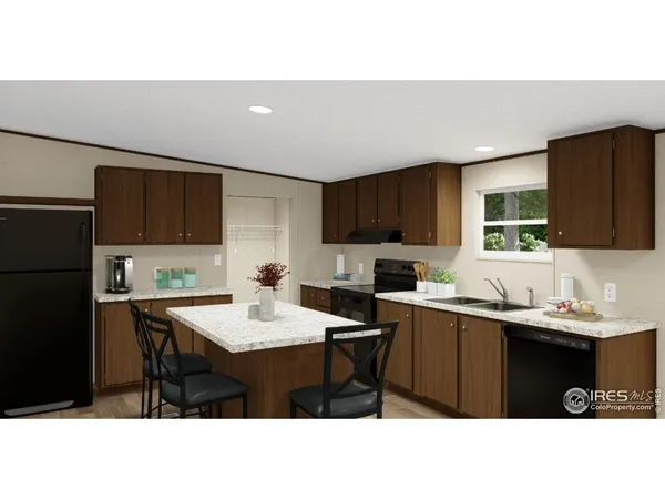 a kitchen with a sink a counter top space and stainless steel appliances