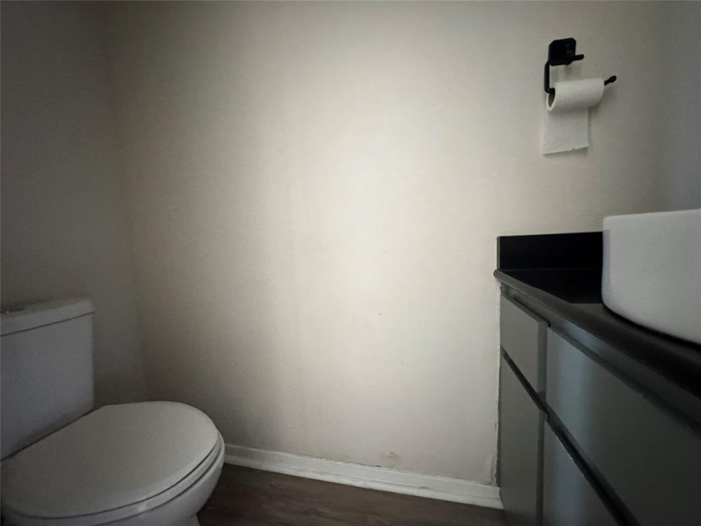 1421 South 12th Street, Unit 107 Waco, TX 76706 - Photo 22 of 25 a bathroom with a toilet