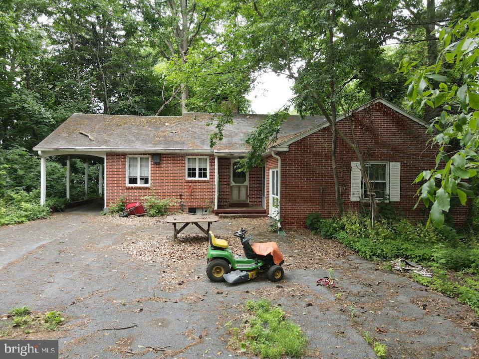 1733 Lancaster Road Manheim, PA 17545 - Photo 3 of 22 a front view of a house with garden