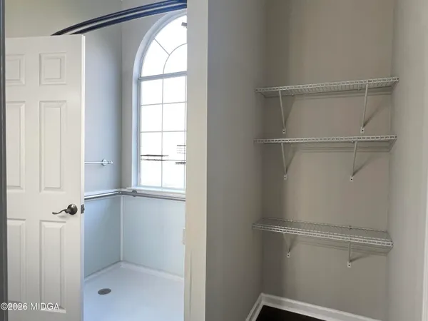 a bathroom with a glass shower door