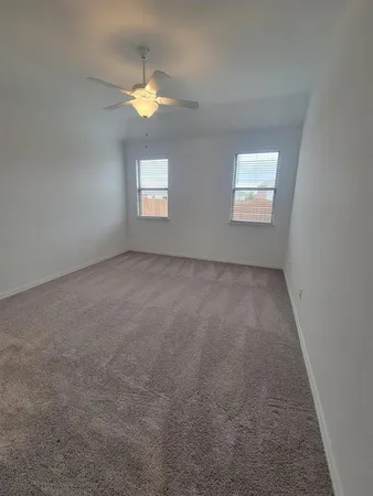 an empty room with a empty space and a window
