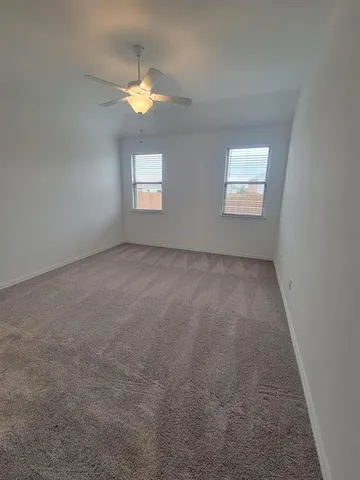 an empty room with a empty space and a window