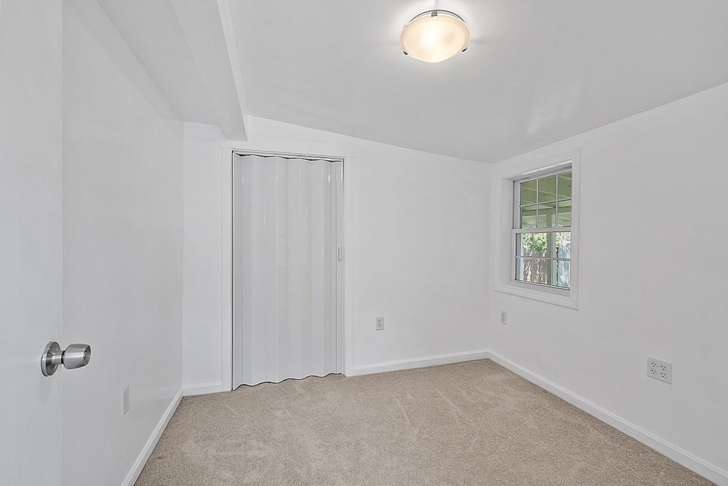 20 Fern Lane Manchester, NH 03109 - Photo 5 of 34 a view of an empty room with a window