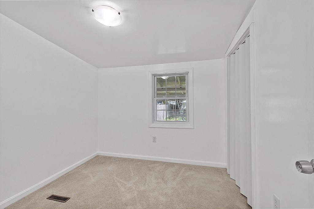 20 Fern Lane Manchester, NH 03109 - Photo 6 of 34 an empty room with windows