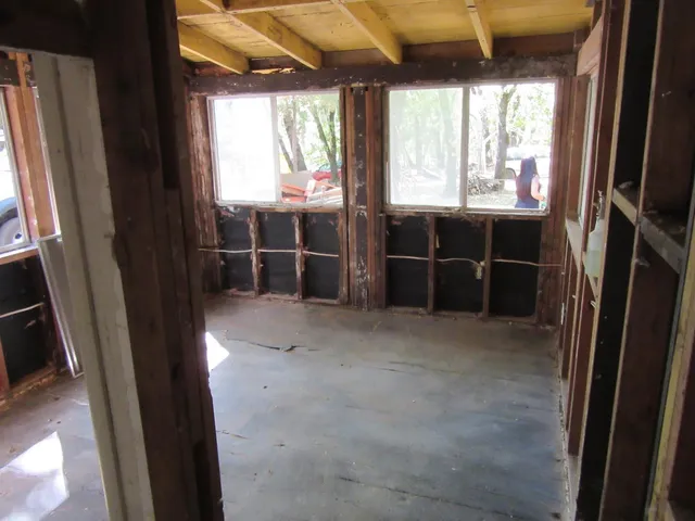 a view of an empty room with a window