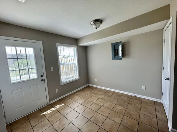 a view of an empty room and window