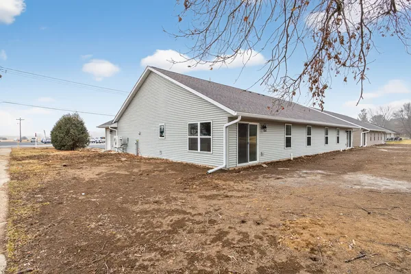 a view of a house with a backyard