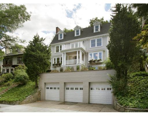 121 University Road, Unit 1 Brookline, MA 02445 - Photo 1 of 13 a front view of a house with a garden