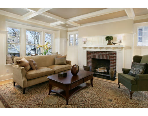 121 University Road, Unit 1 Brookline, MA 02445 - Photo 4 of 13 a living room with furniture and a fireplace