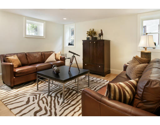 121 University Road, Unit 1 Brookline, MA 02445 - Photo 5 of 13 a living room with furniture and a wooden floor