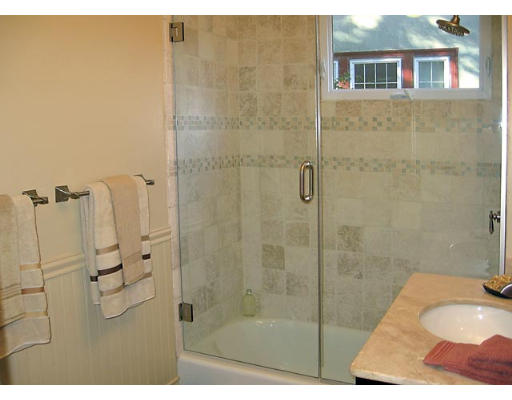 121 University Road, Unit 1 Brookline, MA 02445 - Photo 10 of 13 a bathroom with a sink and shower