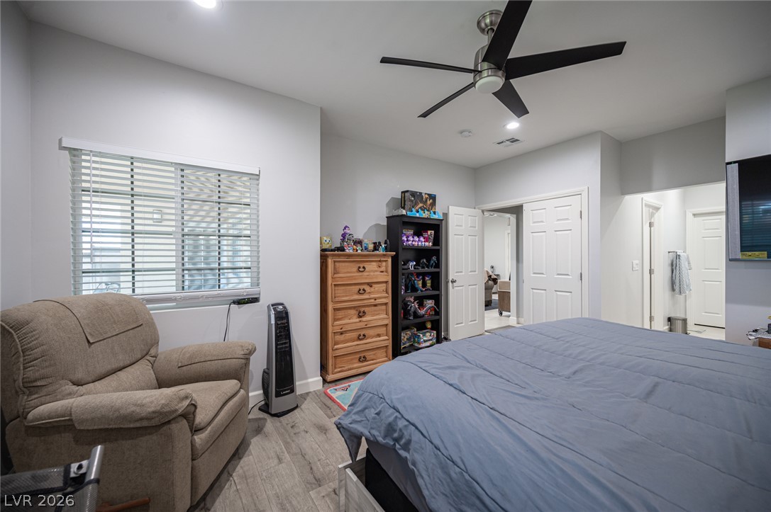 441 Belville Road Pahrump, NV 89048 - Photo 29 of 44 Comfortable bedroom features elegant vinyl flooring and a stylish ceiling fan.