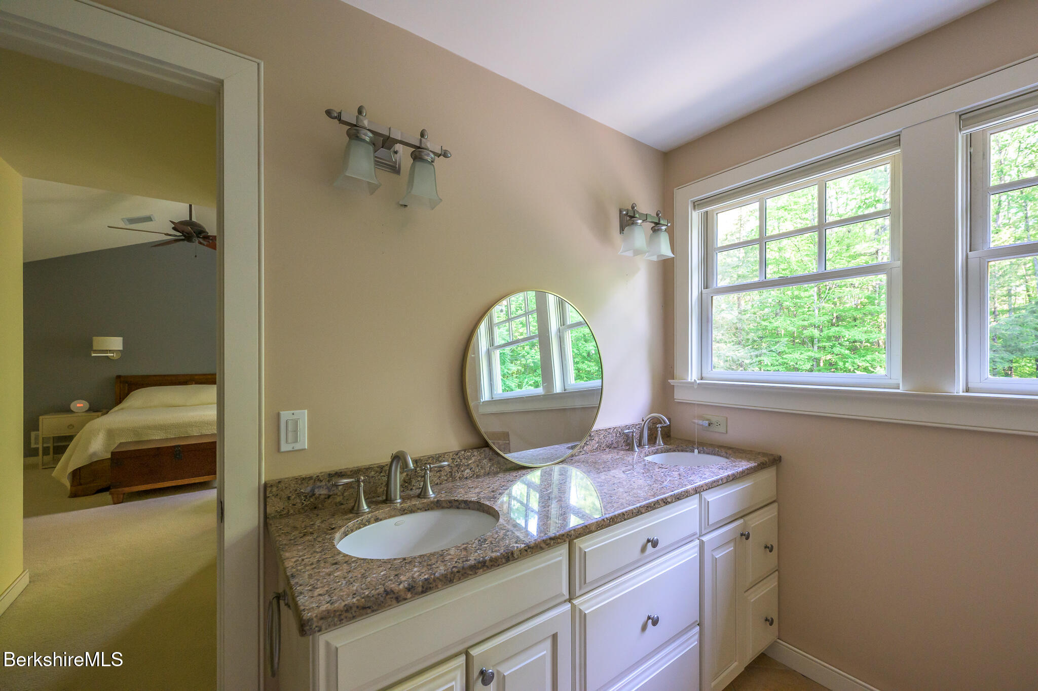 430 Lenox Road Richmond, MA 01254 - Photo 46 of 66 a bathroom with a granite countertop sink a large mirror and a window