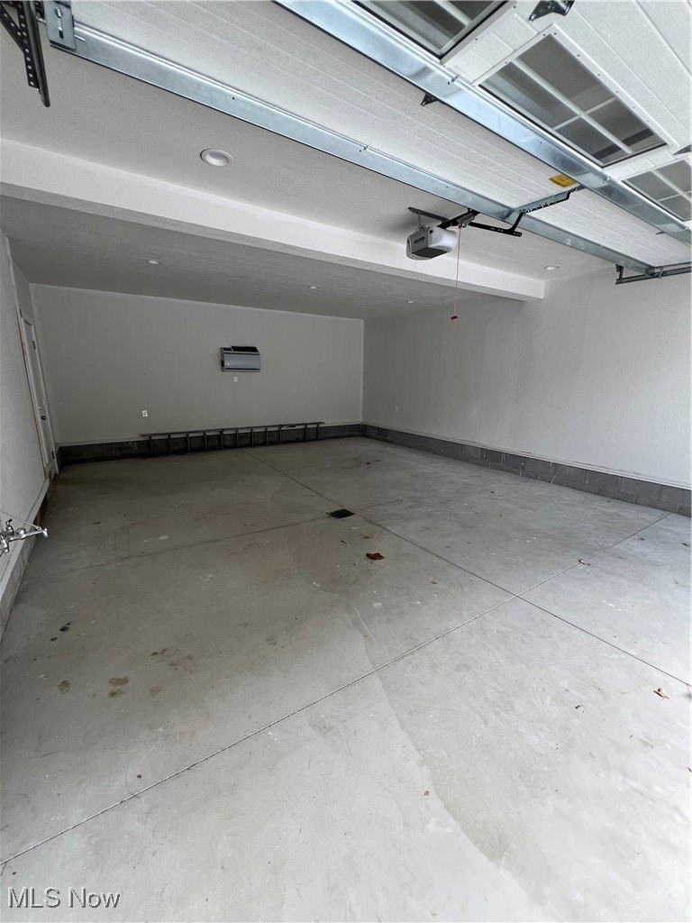 815 Sugar Road Akron, OH 44321 - Photo 21 of 22 NEW over-sized garage featuring a garage door opener, water, heated, and recessed lighting.