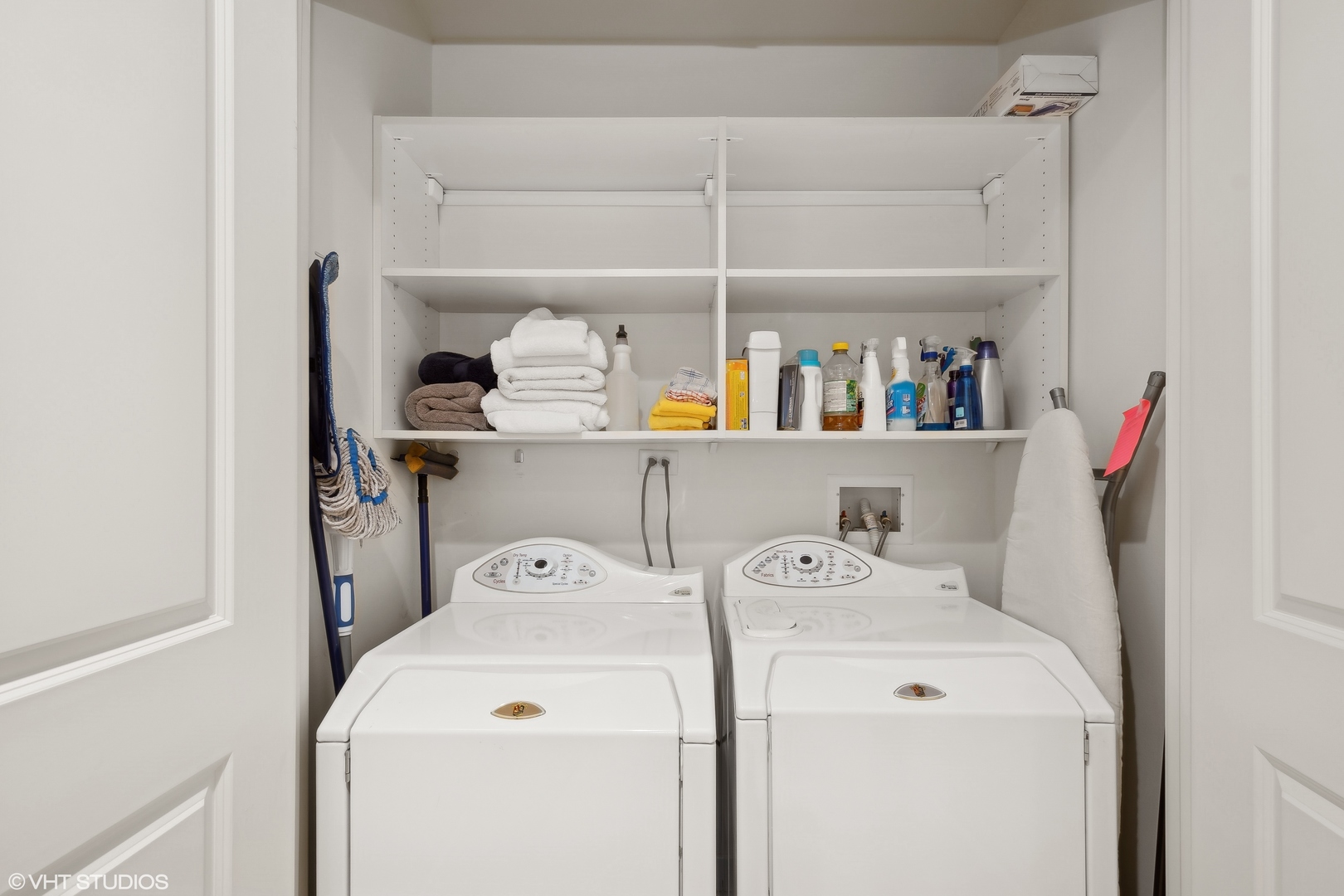 55 East Erie Street, Unit 2103 Chicago, IL 60611 - Photo 18 of 24 a view of storage and utility room with washer and dryer