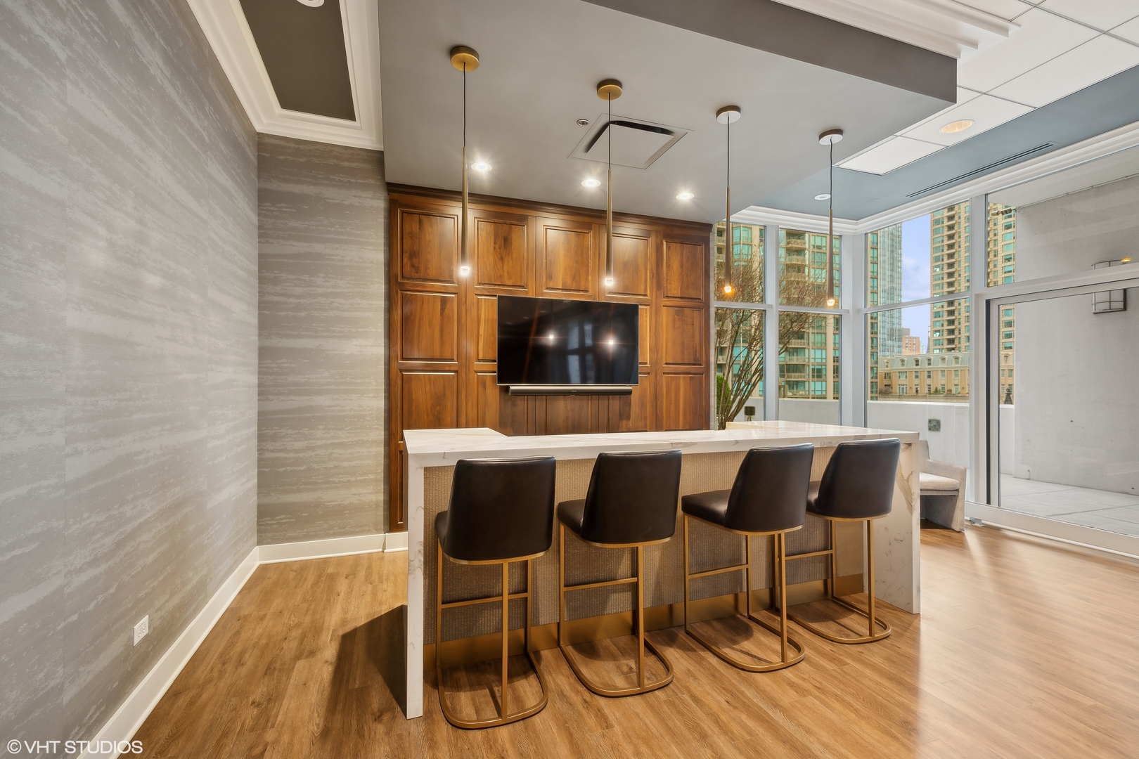 55 East Erie Street, Unit 2103 Chicago, IL 60611 - Photo 23 of 24 a view of a dining room with furniture wooden floor and chandelier