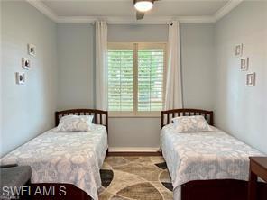1812 Avian Court, Unit A78 Naples, FL 34119 - Photo 13 of 19 a bedroom with a bed and window