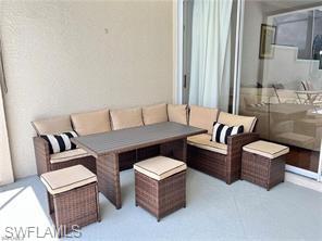 1812 Avian Court, Unit A78 Naples, FL 34119 - Photo 15 of 19 a living room with furniture and a potted plant