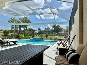 a view of a patio with table and chairs potted plants with wooden floor
