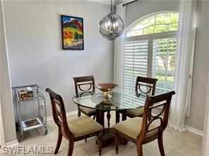 1812 Avian Court, Unit A78 Naples, FL 34119 - Photo 6 of 19 a view of a dining room with furniture window and outside view