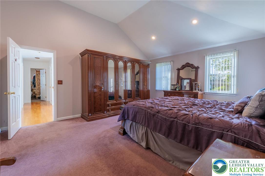2170 Clearview Road Coplay, PA 18037 - Photo 35 of 75 This primary bedroom features high vaulted ceilings and plush carpeting, creating a peaceful retreat.