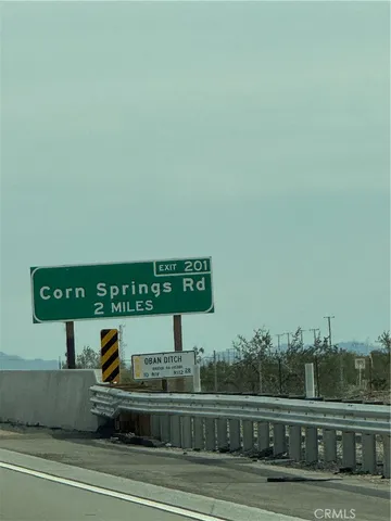 a sign board on the side of a road