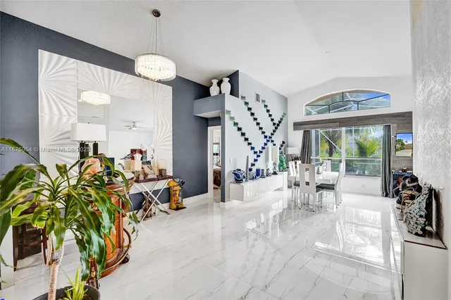 a kitchen with a refrigerator and a sink