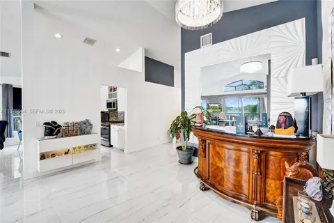 a kitchen with a refrigerator and a sink