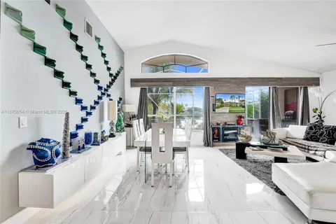 a spacious bathroom with a double vanity sink a mirror and a bathtub