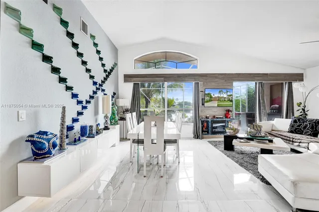 a spacious bathroom with a double vanity sink a mirror and a bathtub
