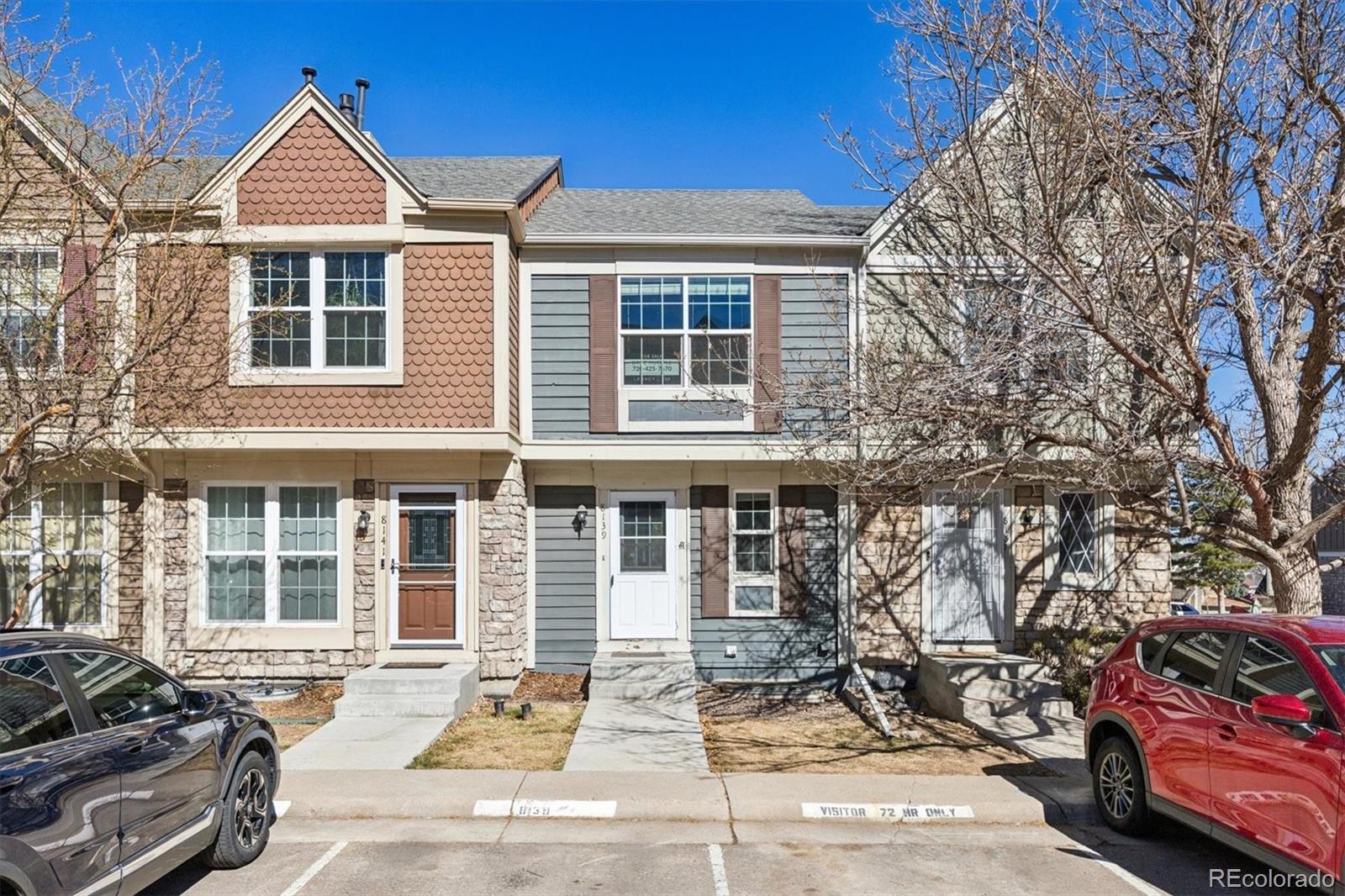 a front view of a house with parking area