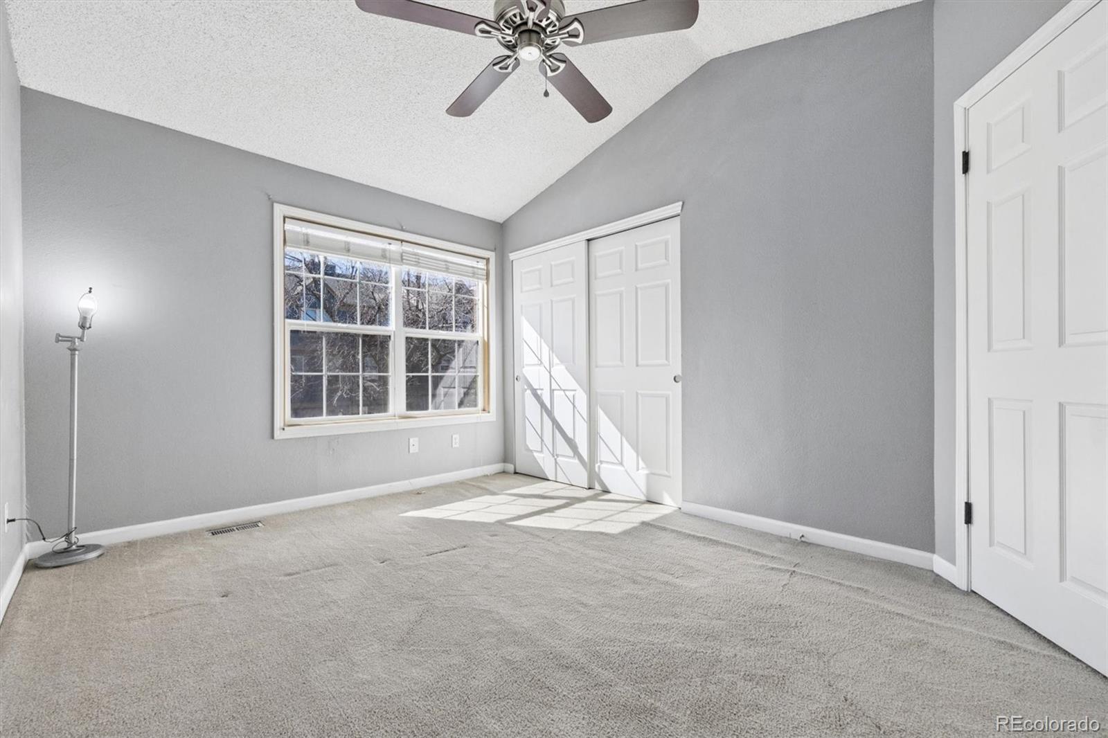 8139 South Fillmore Way Centennial, CO 80122 - Photo 12 of 29 a view of an empty room with a window