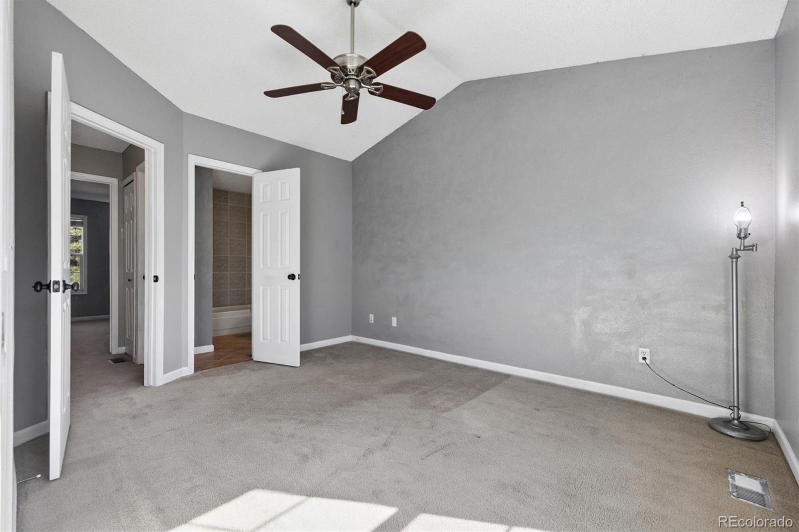 8139 South Fillmore Way Centennial, CO 80122 - Photo 17 of 29 an empty room with chandelier fan