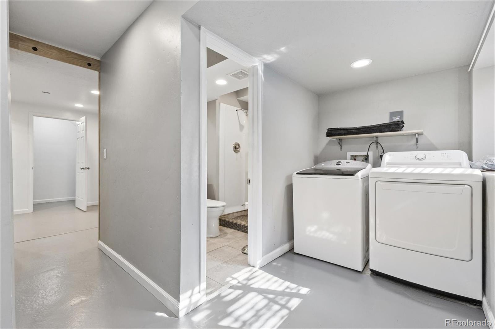 8139 South Fillmore Way Centennial, CO 80122 - Photo 18 of 29 a view of utility room with washer and dryer