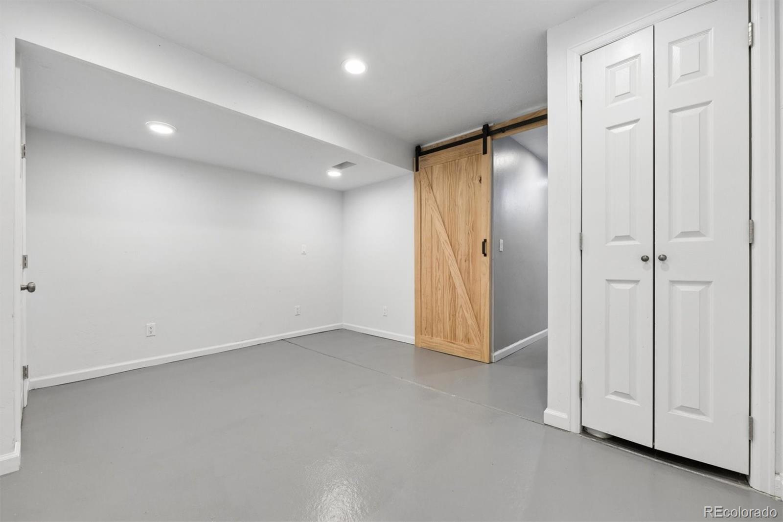 8139 South Fillmore Way Centennial, CO 80122 - Photo 23 of 29 an empty room with a hallway
