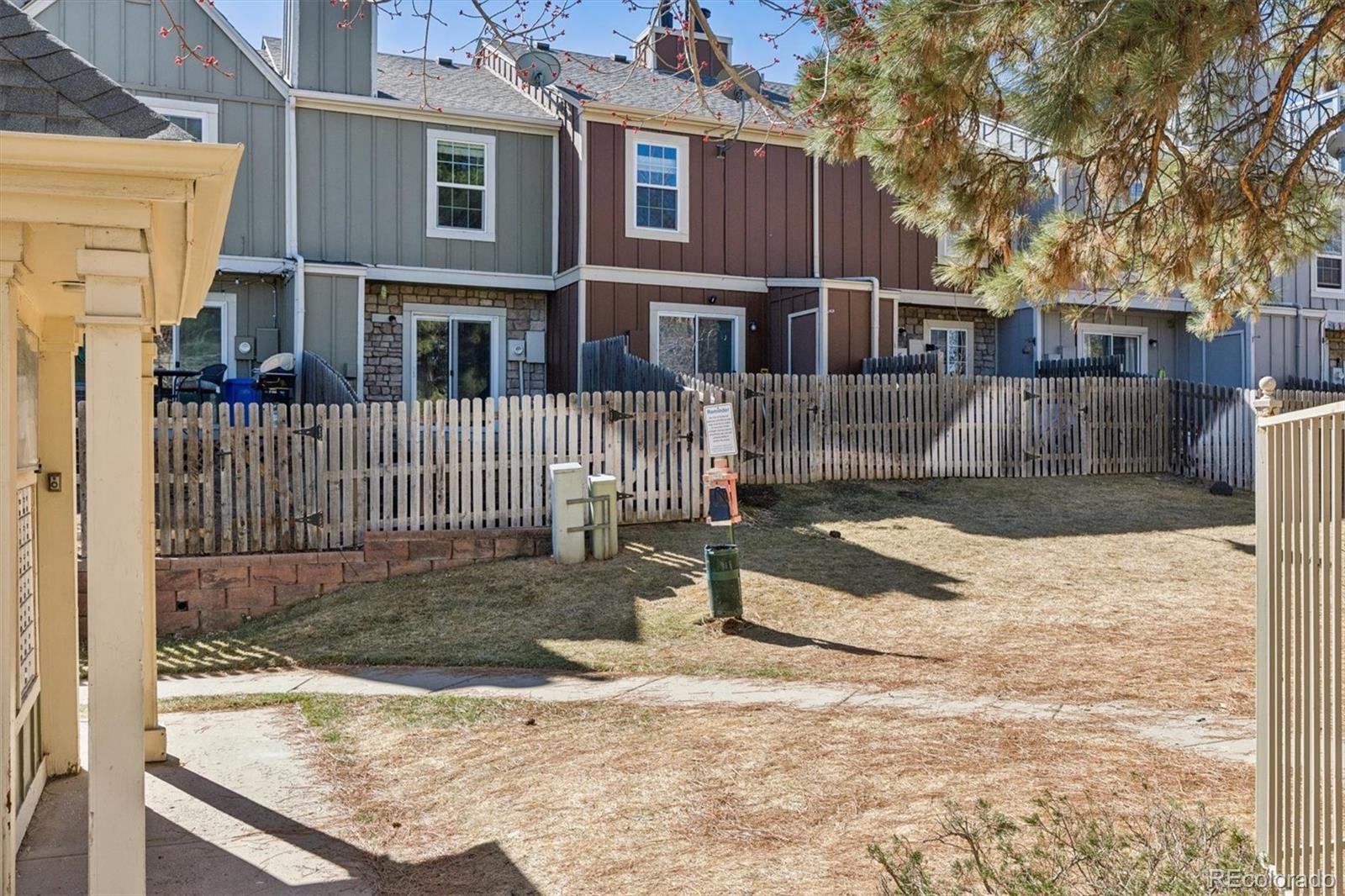 8139 South Fillmore Way Centennial, CO 80122 - Photo 28 of 29 a view of a house with a yard covered in snow