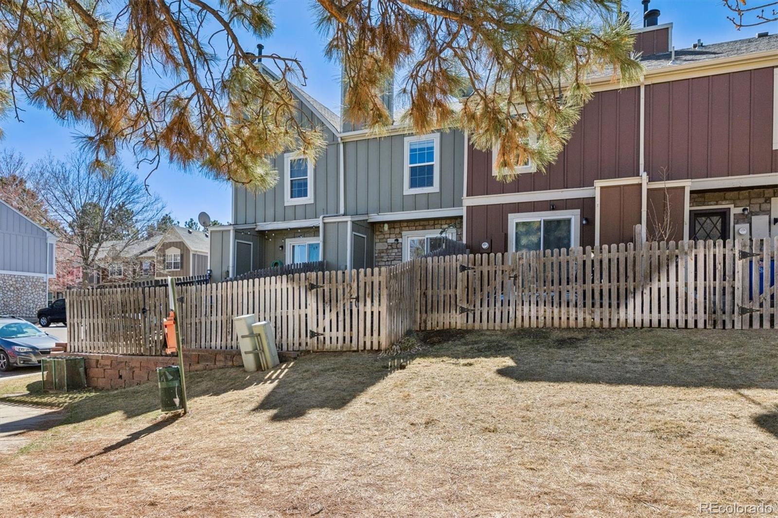 8139 South Fillmore Way Centennial, CO 80122 - Photo 29 of 29 a view of a house with a fence