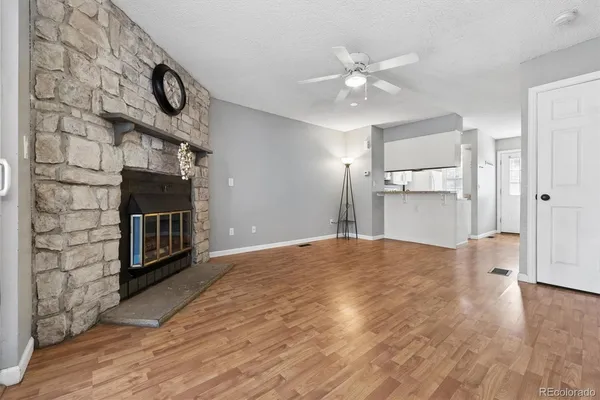 a view of an empty room and fire place