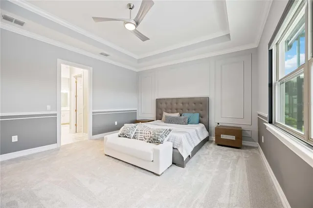 a spacious bathroom with a double vanity sink mirror and toilet