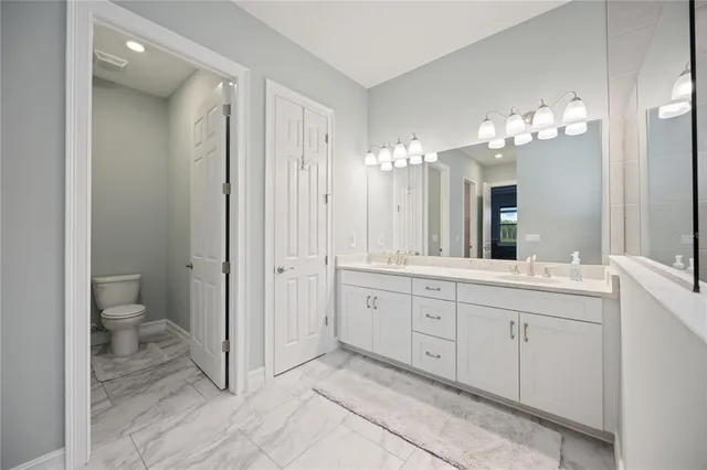 a view of a roof deck with a table and chairs under an umbrella