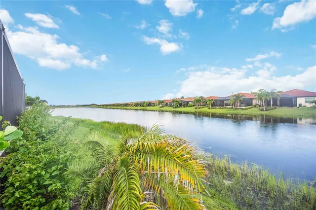 an aerial view of a house with a garden and swimming pool