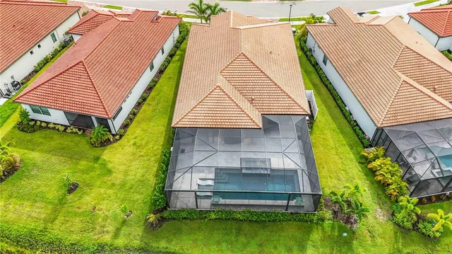 a living room with furniture a table and chairs