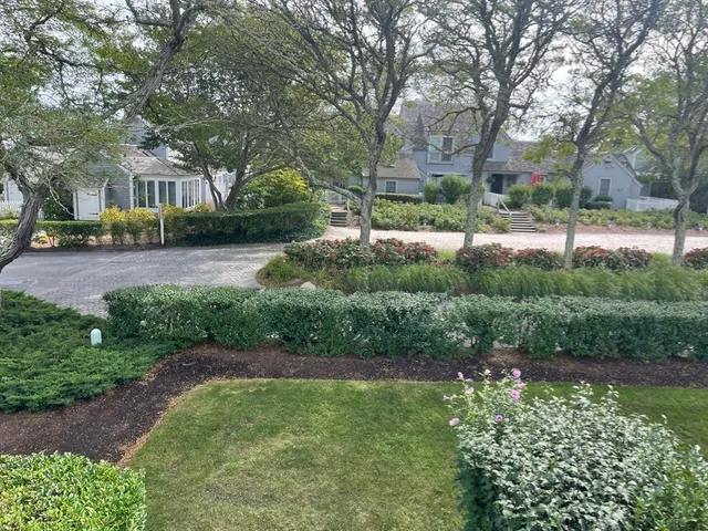 a view of backyard with green space