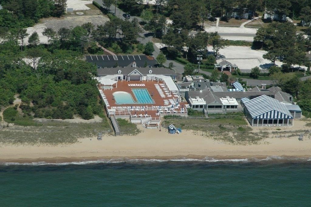 4 Colemans Way, Unit 702 Mashpee, MA 02649 - Photo 20 of 23 an aerial view of a house with outdoor space