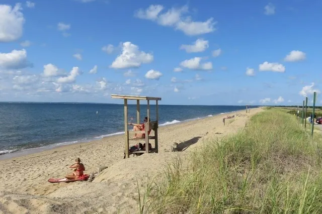 a view of a lake with sitting area